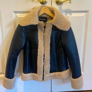 Olivaceous vegan faux leather bomber jacket coat with faux Sherpa lining